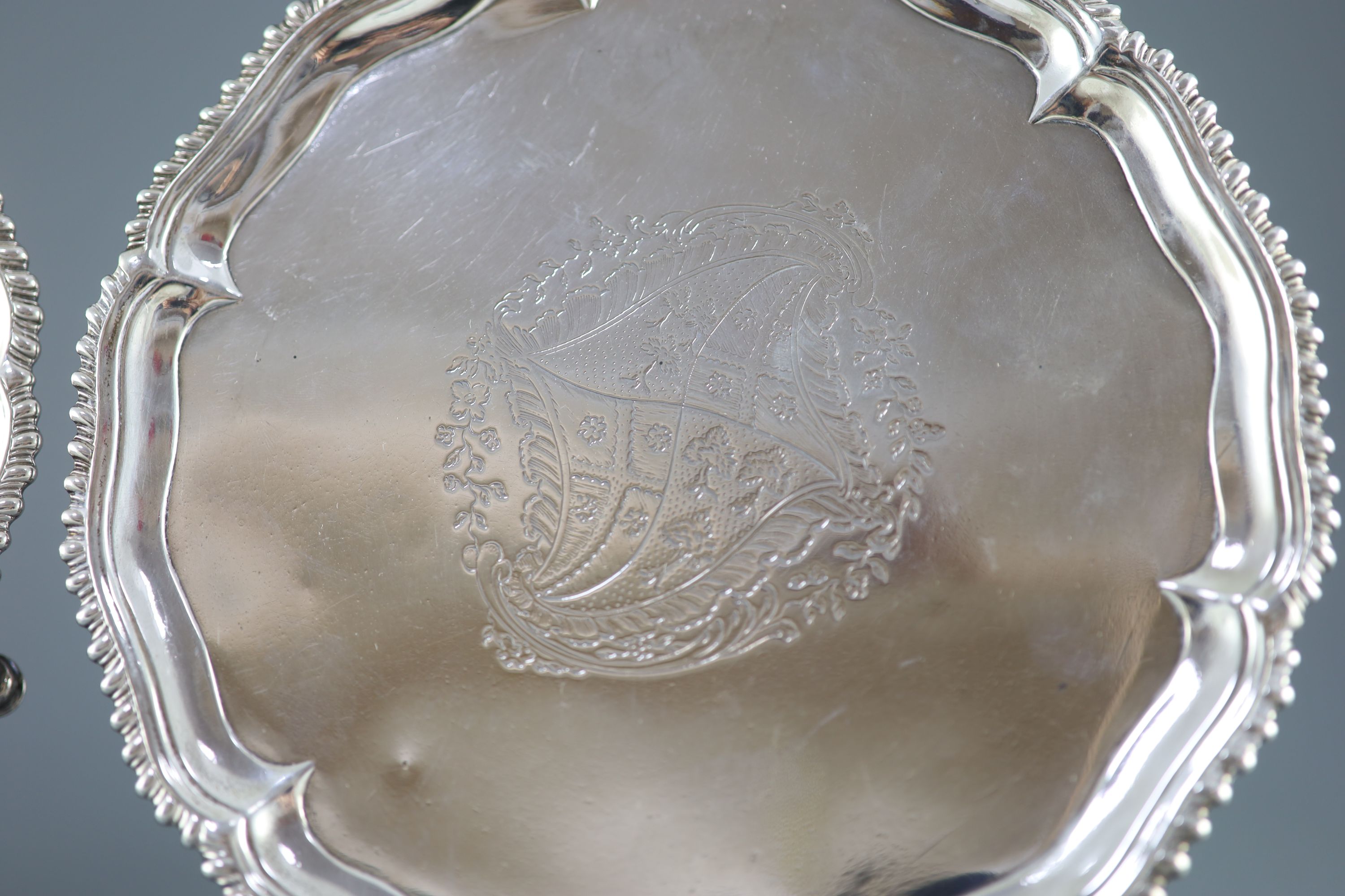 A pair of early George III silver salvers by Richard Rugg,